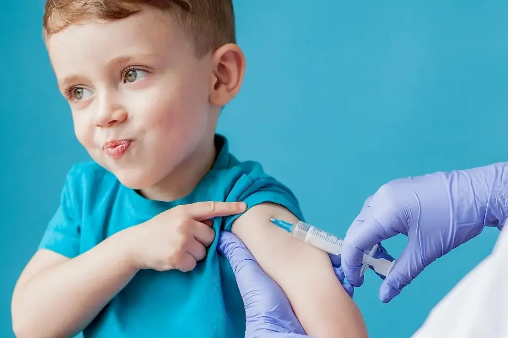 Child receiving an arm vaccination during immunisation at Tiny Totz Kids Clinic in Puppalguda, Hyderabad